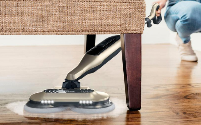 A Person is Holding Shark Steam Scrub All in One Hard Floor Steam Mop