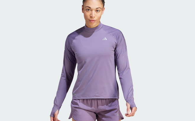 A Person is Wearing Adidas Ultimate Sweatshirt in Shadow Violet Color