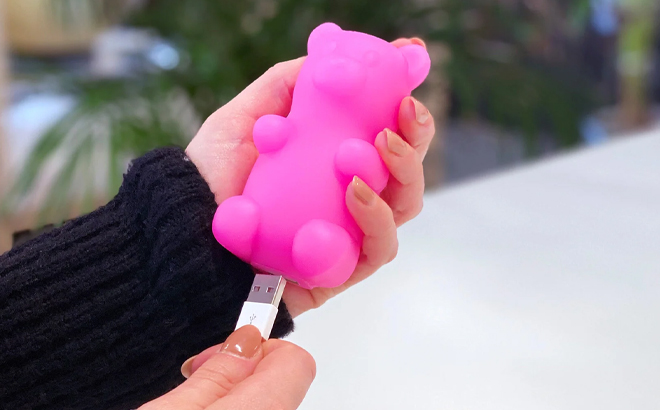 A Woman Holding Moji Power Gummy Bear Power Bank