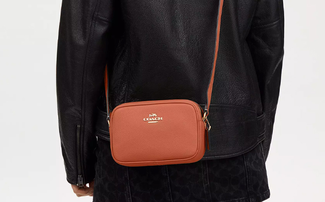 A Woman Wearing Coach Outlet Mini Jamie Camera Bag