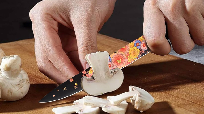 A person slicing the mushroon using the Marco Almond Knife