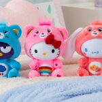 Care Bear x Hello Kitty Plush Toys on a Bed