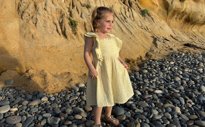 Girl wearing a Yellow Dress on the Shore