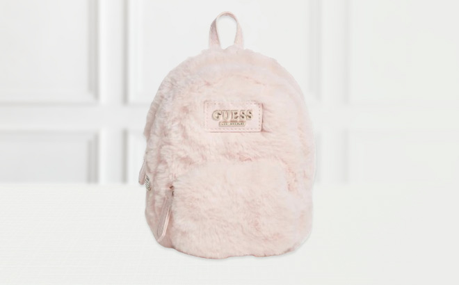 Guess Evan Faux Fur Mini Crossbody Bag on the Table