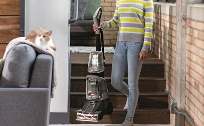 Hand Holding Bissell TurboClean PowerBrush Pet Pro Carpet Cleaner