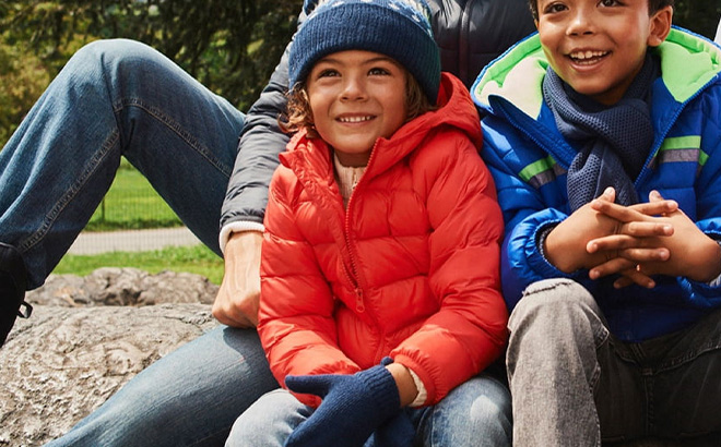 Kid is Wearing Wonder Nation Toddler Boys and Girls Unisex Packable Quilted Puffer Jacket in Coral Castle Color