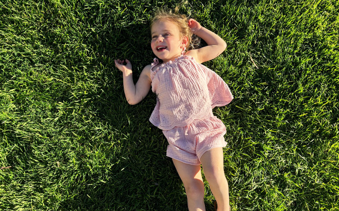 Laughing Girl Laying on Grass