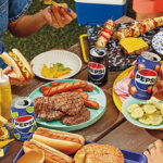 Pepsi Sodas and Food on a Table