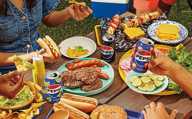 Pepsi Sodas and Food on a Table