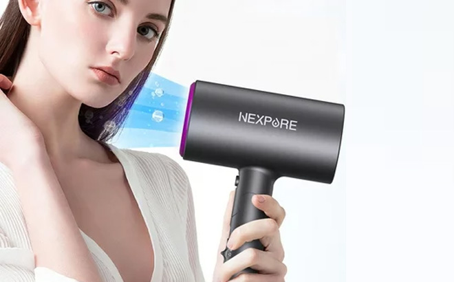 Person Holding Nexpure Hair Dryer