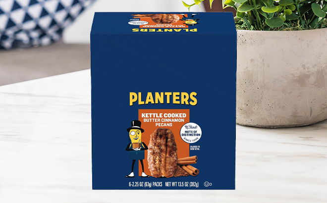 Planters Kettle Cooked Butter Cinnamon Pecans 6 Pack on a Table