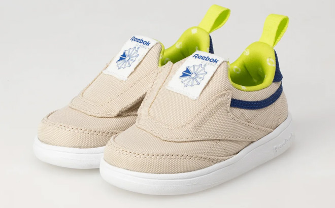 Reebok Toddler Club C IV Slip On Sneakers on Biege Background