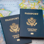 Two US Passports on a World Map