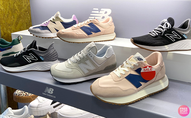 Various Styles of New Balance Sneakers on a Shelf