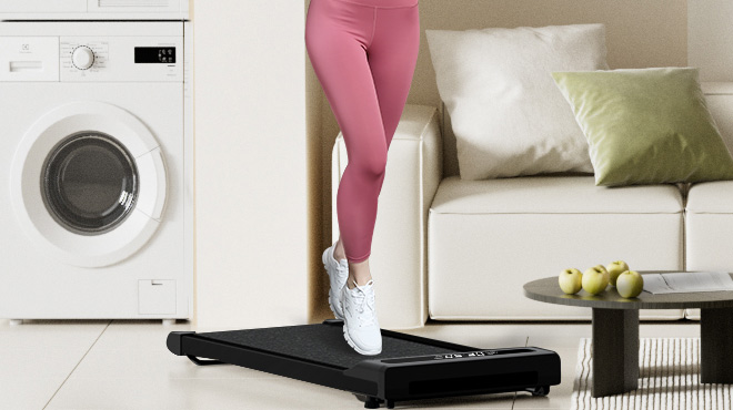 Woman Running on the Notius Under Desk Walking Pad Treadmill