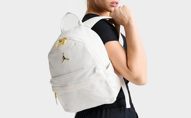 Woman is Holding Jordan Corduroy Mini Backpack