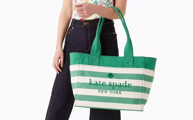 Woman is Holding Kate Spade Jett Large Tote in Green Color