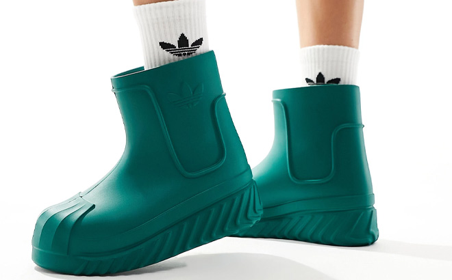 Woman is Wearing Adidas Adifom SST Boot Shoes in Collegiate Green Color