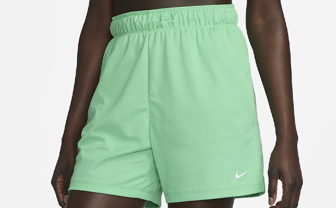 Woman is Wearing Nike Attack Womens Dri FIT Fitness Mid Rise Unlined Shorts