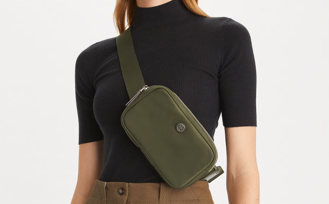 Woman is Wearing Tory Burch Virginia Belt Bag in Olive Green Color