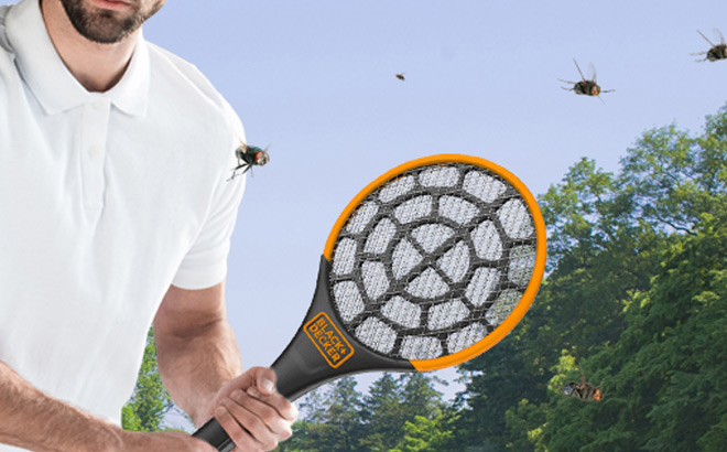 a Man Holding Black Decker Electric Fly Swatter