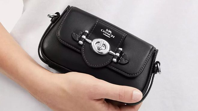 a Person Holding Coach Outlet Brie Mini Crossbody