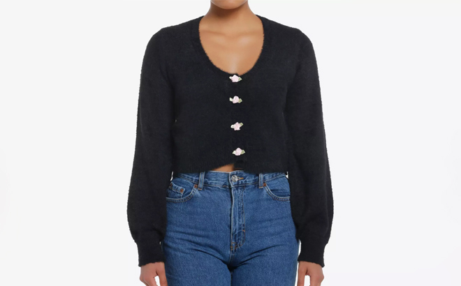 a Person Wearing a Sweet Society Black Fuzzy Rosette Buttons Crop Girls Cardigan