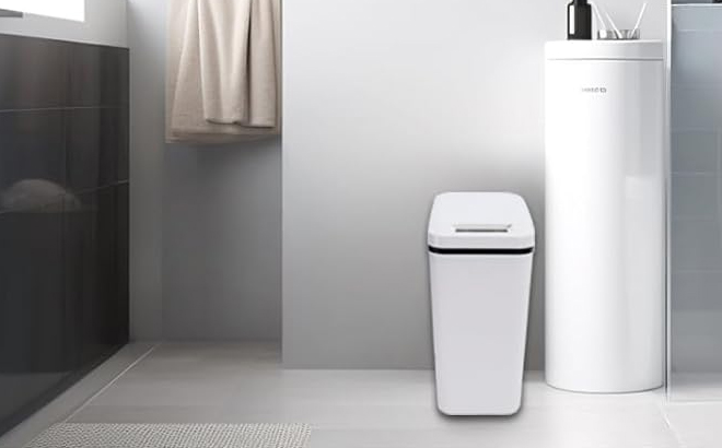 2 5 Gallon Automatic Trash Can on the Bathroom Floor in the Color White