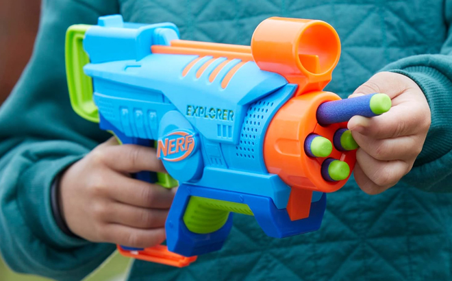 A Boy Holding NERF Elite Junior Explorer Foam Blaster