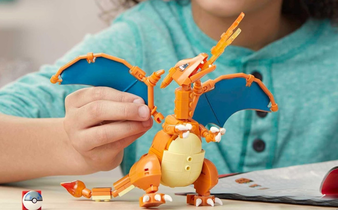 A Child Playing with Mega Pokemon Charizard