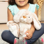 A Girl Holding Melissa Doug Burrow Bunny Rabbit Plush