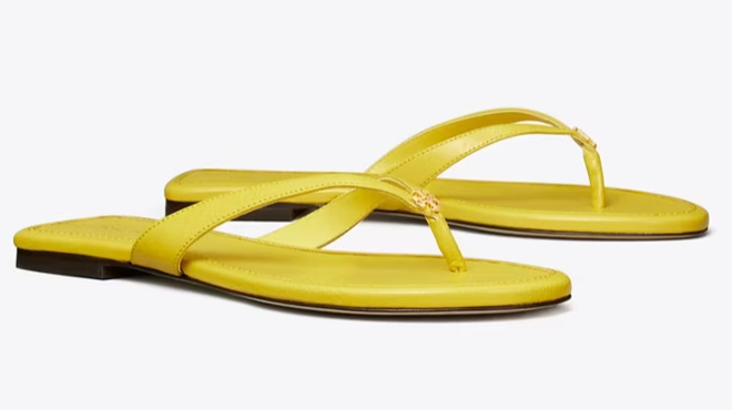 A Pair of Tory Burch Classic Flip Flop in Colza Yellow Color