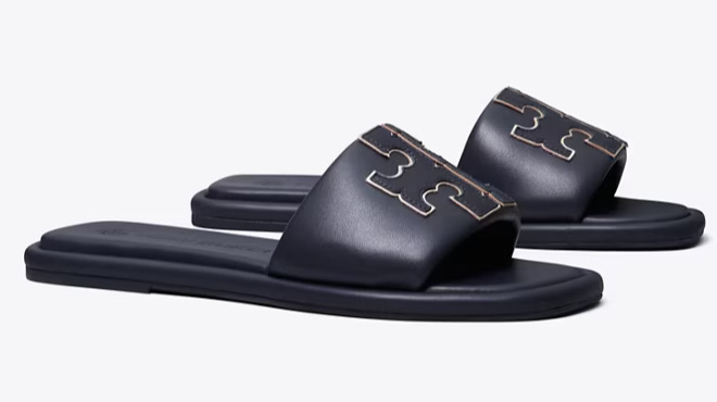 A Pair of Tory Burch Double T Sport Slide in Perfect Navy Gold Color