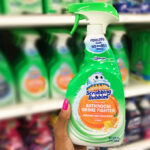 A Person Holding Scrubbing Bubbles Disinfectant Bathroom Grime Fighter Spray