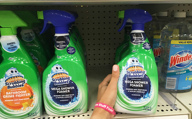 A Person Holding Scrubbing Bubbles Mega Shower Foamer Disinfecting Spray