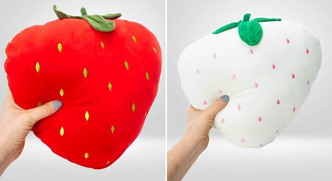 A Person Holding Strawberry Plush Pillow in Red and White Color