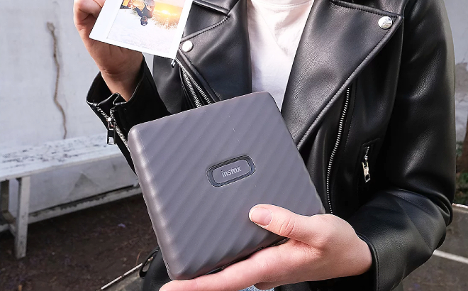 A Person Holding a Photo Printed from Fujifilm Instax Bluetooth Photo Printer