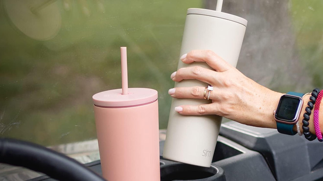 A Person Holding a Simple Modern 28 Ounce Tumbler in Almond Birch Color