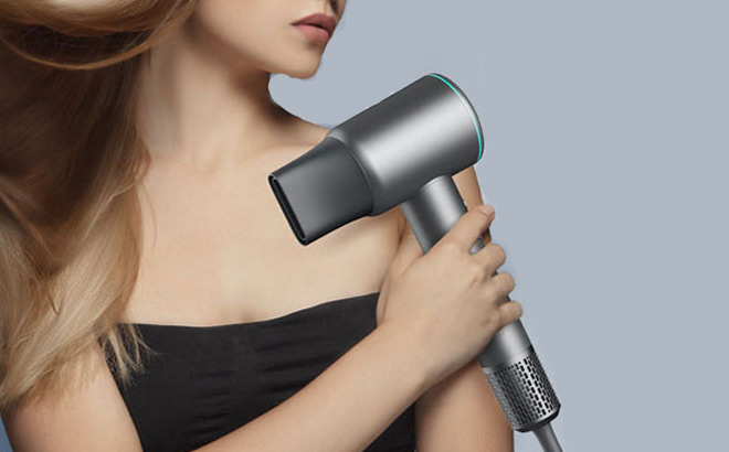 A Person Holding a Yinole Hair Dryer