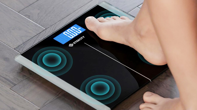 A Person Stepping on a Etekcity Digital Bathroom Scale