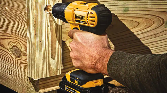 A Person Using Dewalt Cordless Drill Driver