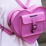 A Person Wearing Dr Martens Leather Heart Shaped Backpack