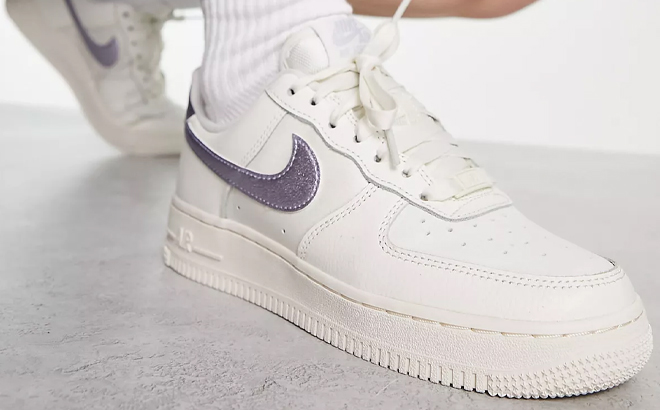 A Woman Wearing Nike Air Force 1 07 ESS Sneakers