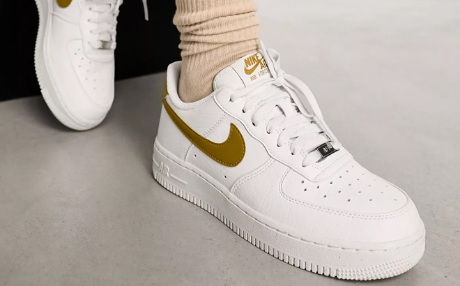 A Woman Wearing Nike Air Force 1 '07 SE Sneakers