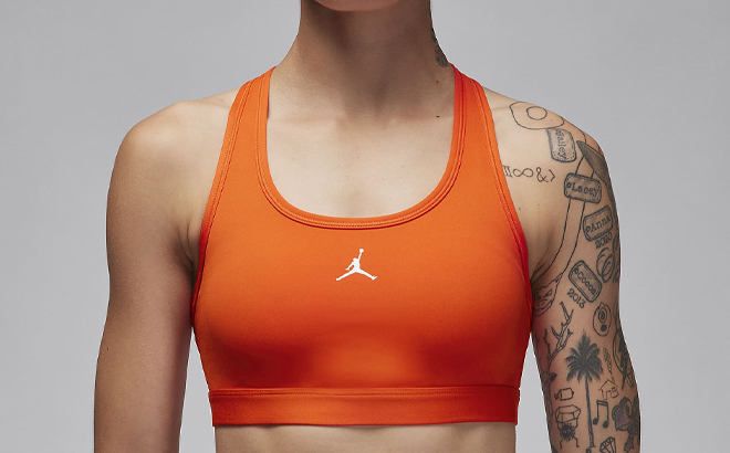 A Woman Wearing Nike Jordan Sport Medium Support Padded Jumpman Bra