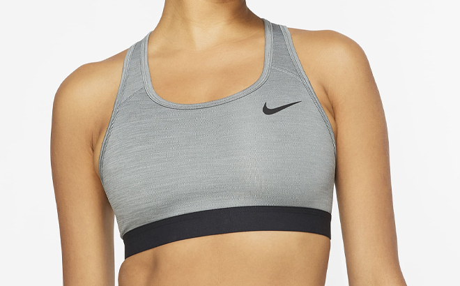 A Woman Wearing Nike Swoosh Medium Support Non Padded Sports Bra