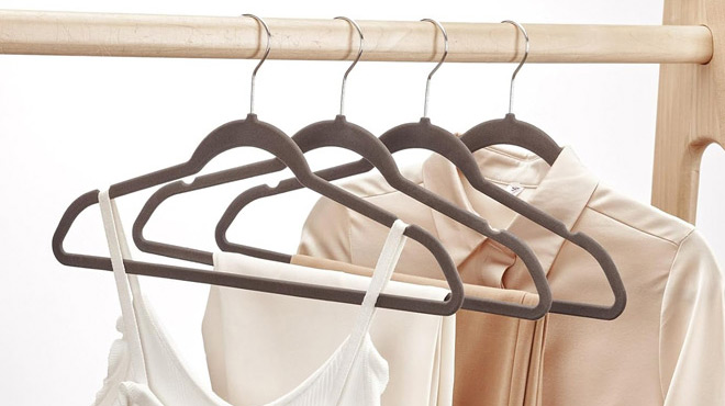 Clothes hanged using a House Day Taupe Velvet Hangers