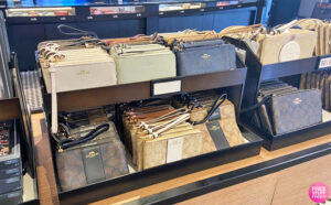 Coach Outlet Wristlets On a Display Table