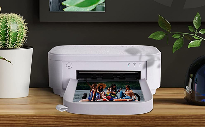 HP Sprocket Studio Plus Wi Fi Portable Photo Printer on a Table