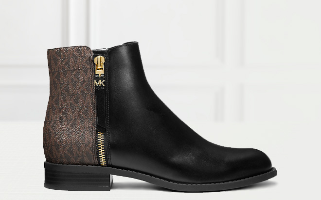 Michael Kors Britt Signature Logo Trim Ankle Boot on the Table